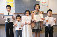 Children holding signs