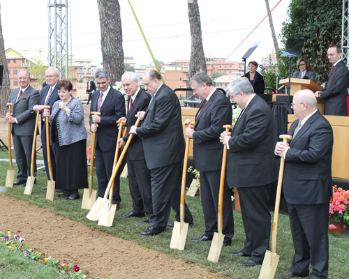 Church leaders and officials, led by Church President Thomas S. Monson, turn over shovels full of dirt, signifying the beginning of construction for the Rome Italy Temple.
