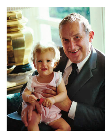Elder Scott holding a young child