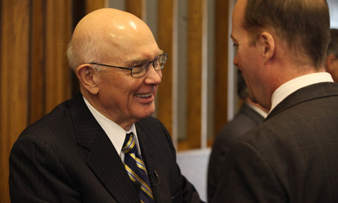 Elder Oaks and a local leader