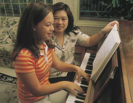 Mother and daughter at the piano