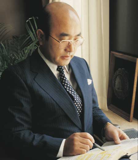 Elder Yoshihiko Kikuchi, emeritus general authority of the Church of Jesus Christ of Latter-Day Saints, studying his scriptures