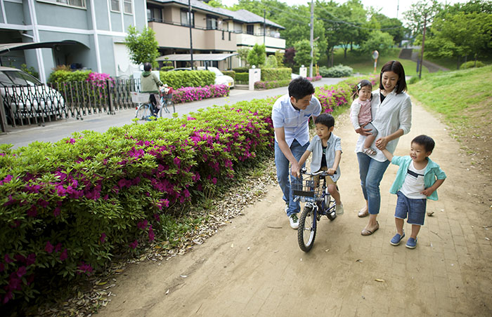 Family with child on bike