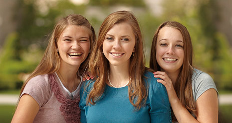 three young women smiling