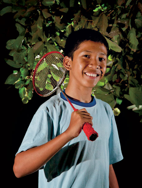 young man with badminton racquet