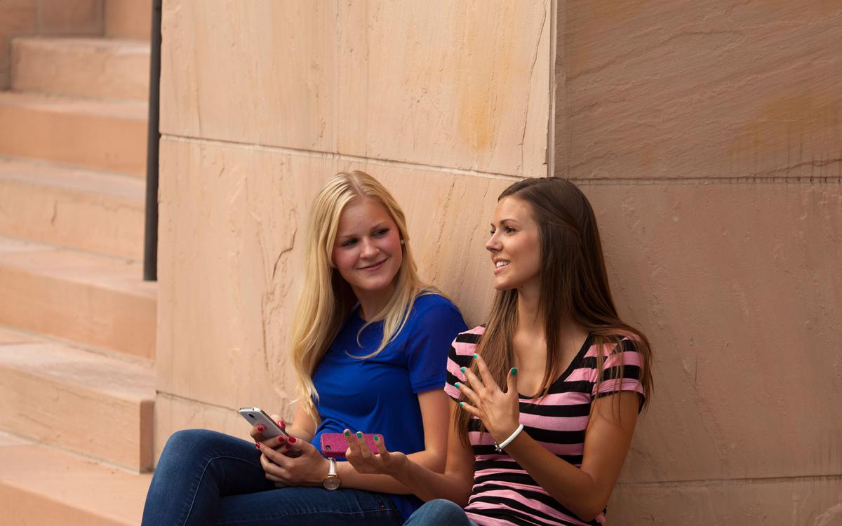 Two young women talking