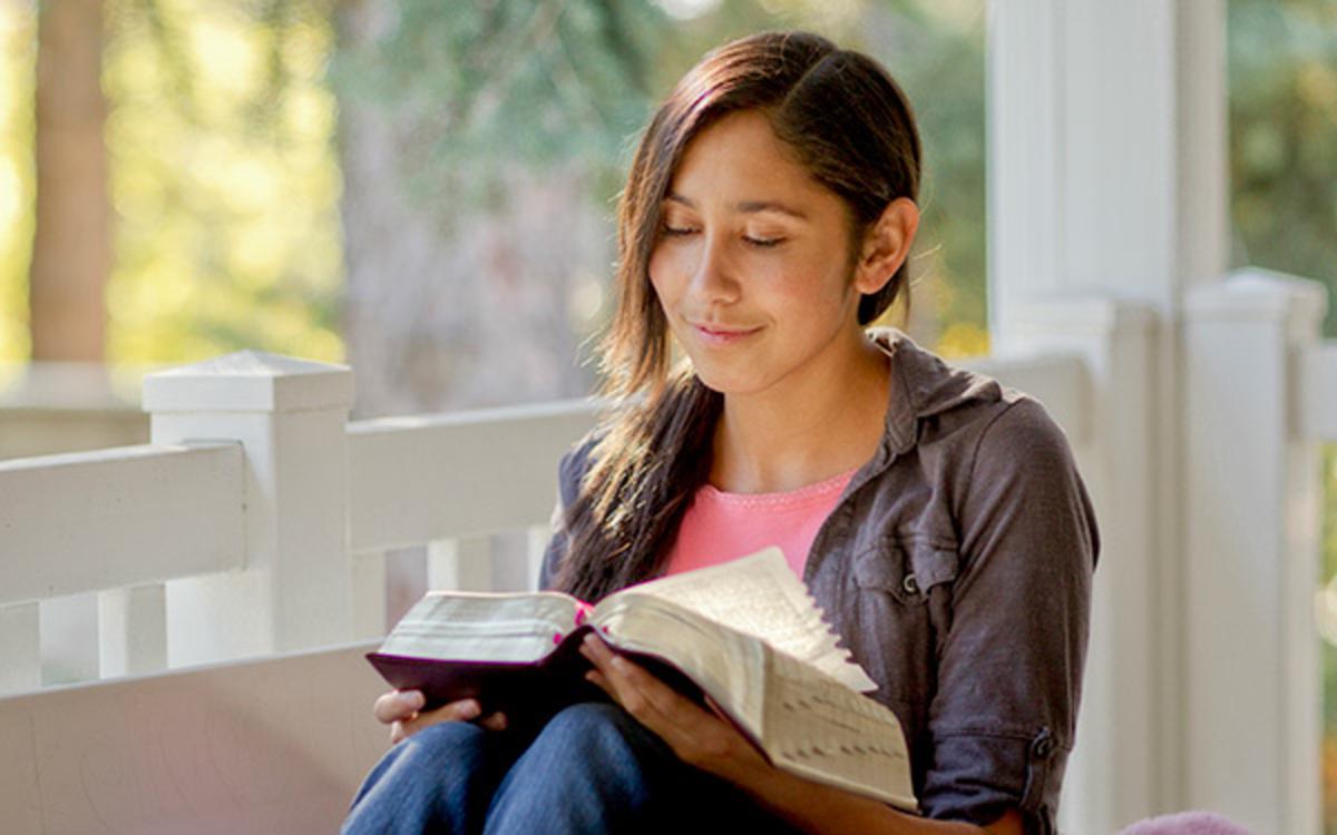 Young woman reading scriptures